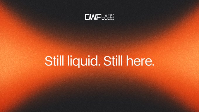 The image features a branded graphic with "DWF LABS" logo at the top and the tagline "Still liquid. Still here." in white text, set against an abstract black and orange gradient background with grainy, fluid-like textures. The bold messaging reinforces DWF Labs' ongoing commitment to market-making and liquidity provision, aligning with the post's emphasis on powering future markets through liquidity, capital, and infrastructure.