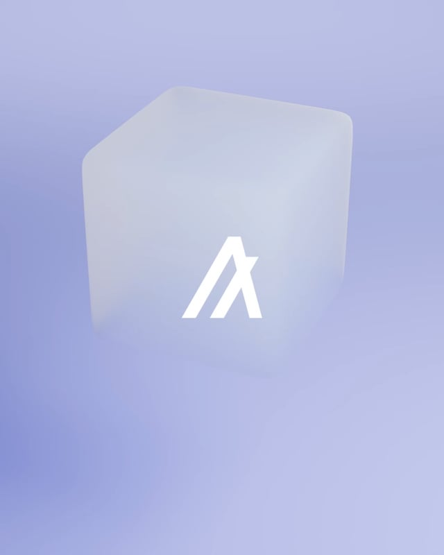 The image features a 3D rendering of an ice cube with the letters "A" and "B" displayed on its surface. The cube appears to be floating or hovering, giving it a unique appearance. The background color of the image is purple, which contrasts with the white letters on the cube. The caption below the image reads: "7 years ago, Algorand produced Block 0!".