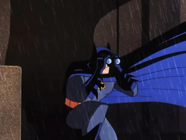 A figure in a blue Batman-like costume with a cape crouches in the rain, peering intently through binoculars from a shadowy rooftop ledge. The image's dark, surveillance-themed aesthetic of watching and waiting from the shadows humorously mirrors the post's tone of cautiously observing the new "Arc" mainnet launch and its uncertain bridging situation.