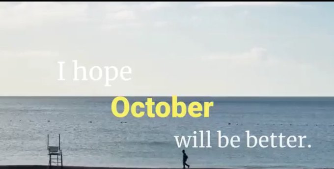 A serene beach scene with ocean, sky, and a lifeguard chair, overlaid with the text 'I hope October will be better.' in white and yellow.