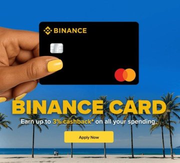 The image features a hand holding up a black credit card with the words "Binance Card" written on it, along with some text about earning points for spending money online. The background of the image shows palm trees and a beach, suggesting that this is an advertisement for a Binance Card designed to make online shopping feel more like real-life experiences.