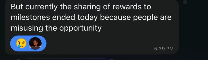 Screenshot of a dark-themed messaging app showing a message that reads 'But currently the sharing of rewards to milestones ended today because people are misusing the opportunity' with a crying emoji reaction, sent at 5:39 PM.