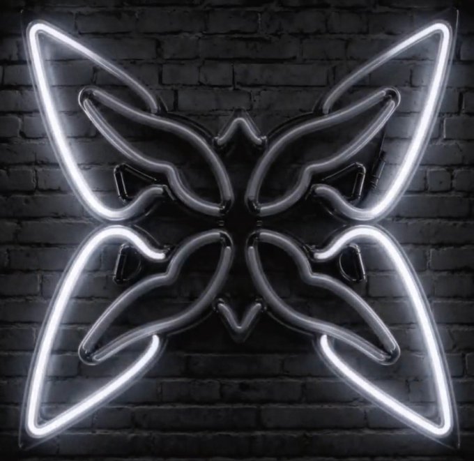 A glowing white neon sign shaped like a butterfly mounted on a dark brick wall.
