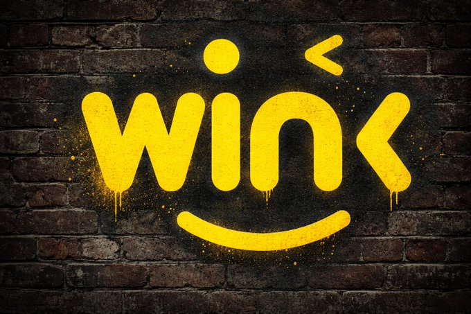 Yellow graffiti-style text spelling 'WINK' with a winking face design is spray-painted onto a dark brick wall.