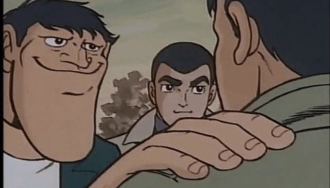 An animated scene showing three male characters, with the central character touching another character's shoulder in what appears to be a conversation.