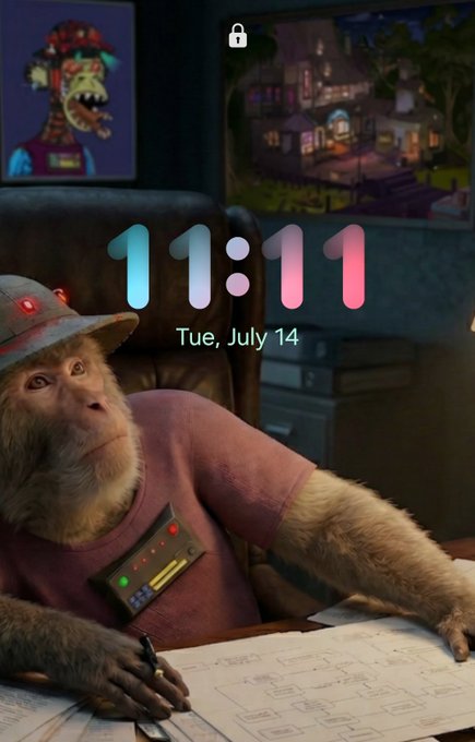 An iPhone lock screen showing the time 11:11 on Tuesday, July 14, featuring a 3D-rendered monkey in a hat sitting at a desk with blueprints and a control panel on its chest.