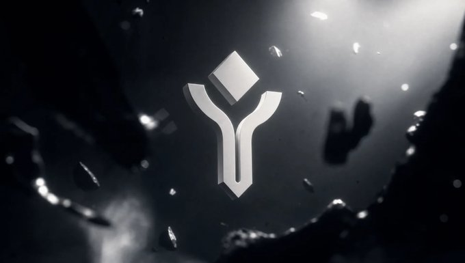A silver geometric logo resembling a stylized 'Y' floats in a dark, space-like environment filled with floating debris and light particles.