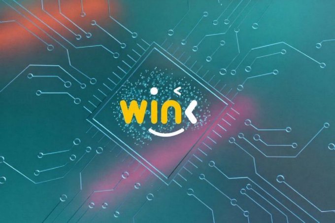 A stylized digital logo 'winx' with a smiley face appears over a glowing teal and orange circuit board background.