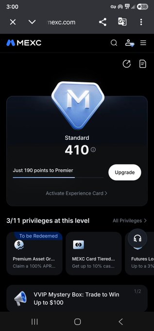 The image shows a MEXC exchange account on a mobile device displaying a "Standard" level of 410 points with a prompt indicating "Just 190 points to Premier," along with a "VVIP Mystery Box: Trade to Win Up to $100" promotion. This relates to the post by highlighting MEXC's tiered reward system and VVIP privileges that users can access without high entry thresholds.