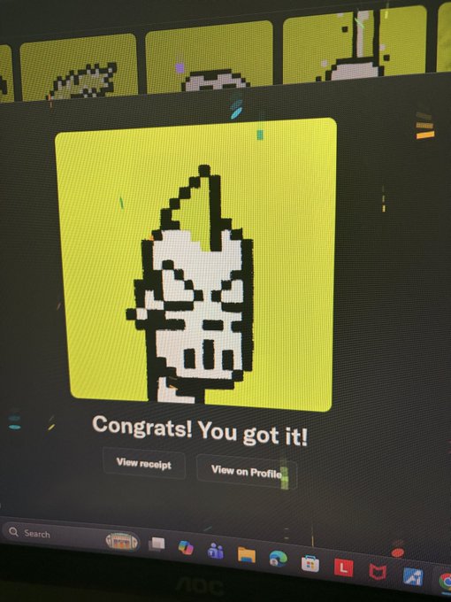 A computer screen displaying a pixel art NFT of a hooded figure with the text "Congrats! You got it!" along with "View receipt" and "View on Profile" buttons.