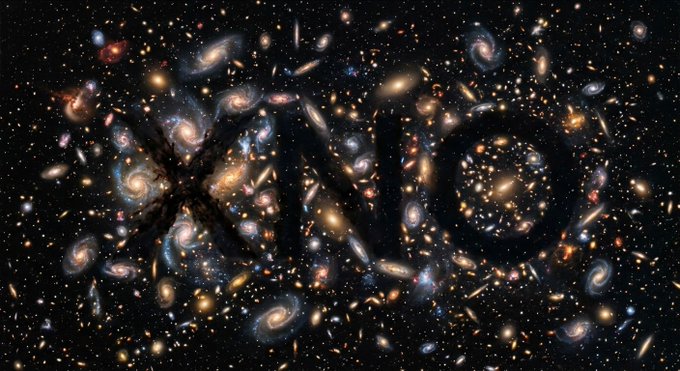 A deep-space astronomical image displaying a dense field of galaxies with spiral shapes and golden/yellow colors against a dark background, resembling a famous Hubble deep-field photograph.