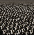 A repeating pattern of stylized white key icons arranged in rows against a dark background.