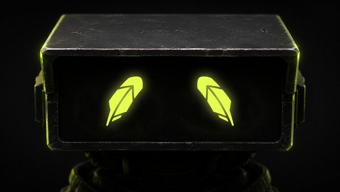 A black, boxy robot head with glowing yellow-green eyes shaped like pen nibs, set against a dark background.