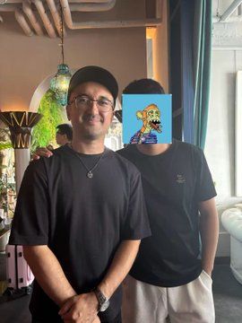 A man wearing glasses and a black cap stands beside another person (whose face is obscured by a Bored Ape NFT graphic) at what appears to be a BAYC community event in Miami. The post references meeting co-foundors like @BoredApeYC and @veratheape, tying the gathering to the Bored Ape Yacht Club community.