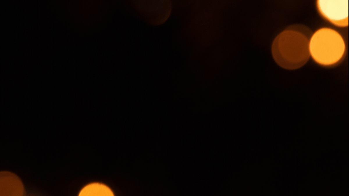 The image features a square frame with three bright orange circles scattered across its surface. The background of the image is black, which contrasts sharply with the vibrant colors of the circles. The text "Mastercard @RLUSD" and "XRP Ledger" are also present in the image.