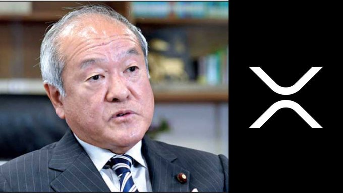 An older man in a pinstripe suit and striped tie is shown on the left, likely a Shinsei Bank executive, alongside the XRP cryptocurrency logo on a black background, illustrating the claim that Shinsei Bank is now rewarding savers with XRP.