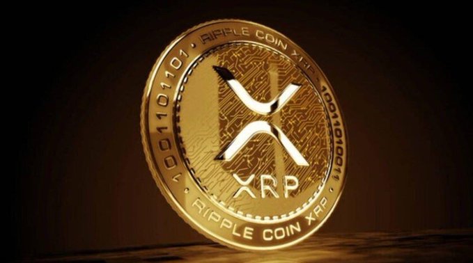 A shiny gold Ripple Coin XRP token rests on a dark surface, displaying the XRP logo and binary text around its edge. The image visually emphasizes the cryptocurrency being highlighted in the post about Franklin Templeton ETF clients purchasing $8.17M worth of XRP.