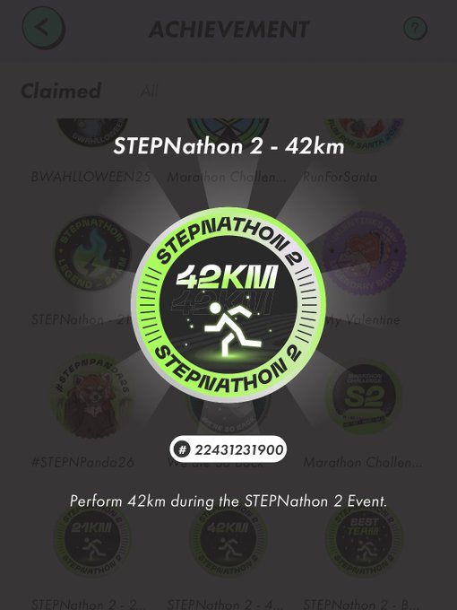 STEPN Achievement screen showing the unlocked badge 'STEPNathon 2 - 42km' (badge #22431231900) for performing 42km during the STEPNathon 2 event, with related challenge badges visible in the background under the Claimed tab.