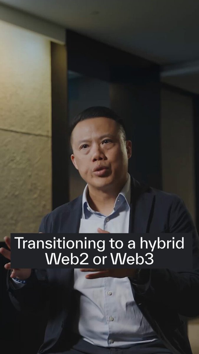 The image features a man wearing a suit sitting down with his hands outstretched as if he's giving a speech or presentation, possibly at an event like Web2.0 or Web3. The caption of the image reads "Sui powers @ONEChampionship ' s People’s Champion award, where fans directly vote for their favorite fighter." This suggests that the man is talking about a specific event related to web development and technology, such as Web2.0 or Web3.