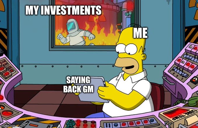 A Simpsons meme showing Homer casually using a tablet labeled 'SAYING BACK GM' while his investments (depicted as an astronaut) are engulfed in flames outside the window.