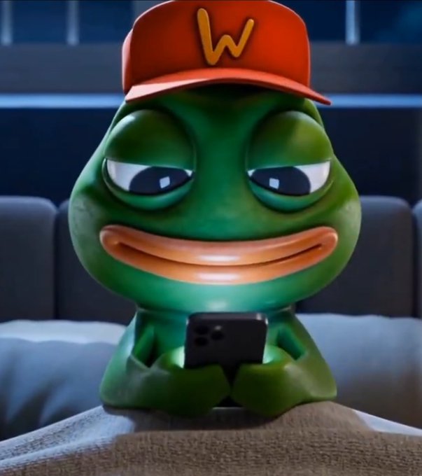The image features the green Pepe frog meme wearing an orange cap with a "W" logo, sitting on a couch and smirking while holding a smartphone. It relates to the post by illustrating the ironic situation of Garrett Jin doubling down on his $ZEC short position that is now over $26M in the red—depicting the "pepe" feeling smugly confident about his losing trade.

Caption: Pepe the Frog in a "W" cap smirks while texting on his phone, humorously embodying the confident holder of a massive losing $ZEC short position that just got even bigger.