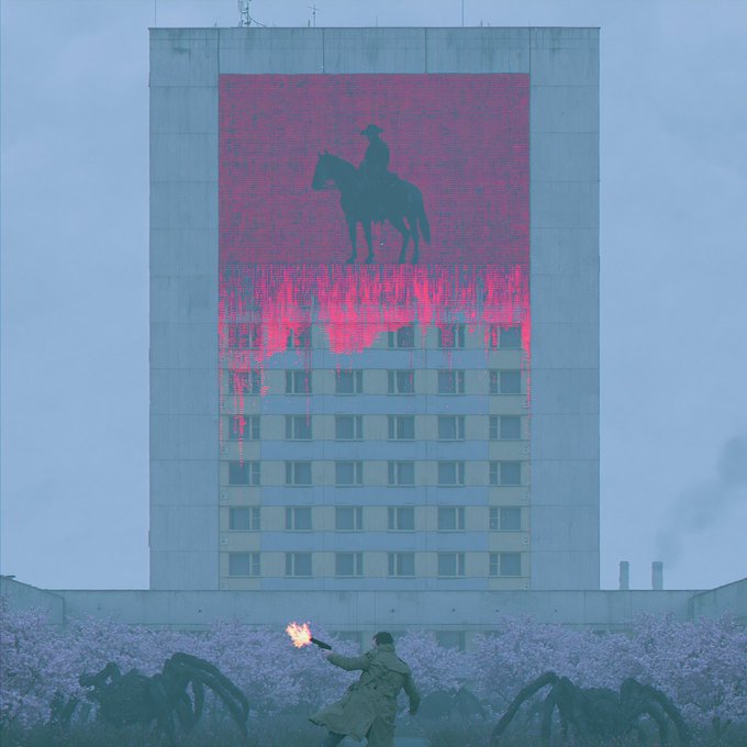 The image features a man standing next to a building, holding a torch that appears to be burning something. The building has a large mural of a cowboy on its side, which adds an interesting visual element to the scene. In addition to the man with the torch and the building, there are several spiders in various positions around the area, creating a sense of movement or activity within the image.