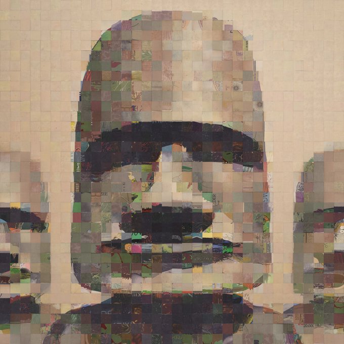A mosaic-style portrait composed of numerous small image tiles depicting a man with a beard, signed 'ATUL 2022' in the bottom right corner.