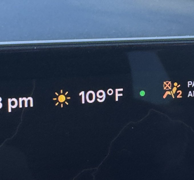 A car's dashboard display shows the time as '6 pm' with a bright sun icon and a temperature reading of 109°F, alongside a passenger airbag indicator.