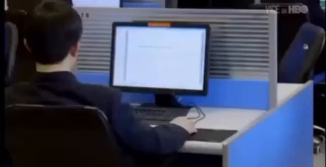 The image shows a man sitting at a desk with a computer monitor, keyboard, and mouse. The background appears to be an office setting or workspace. There are two chairs visible in the scene - one near the man's chair and another further away from him. A TV is also present in the room. The post includes text that reads "You care about seamless payment execution and you haven't explored LI.FI intents LI.FI is where clean execution happens right now." This suggests that the man might be working on a project related to payment processing or financial management, which could involve using LI.FI for seamless execution of payments.