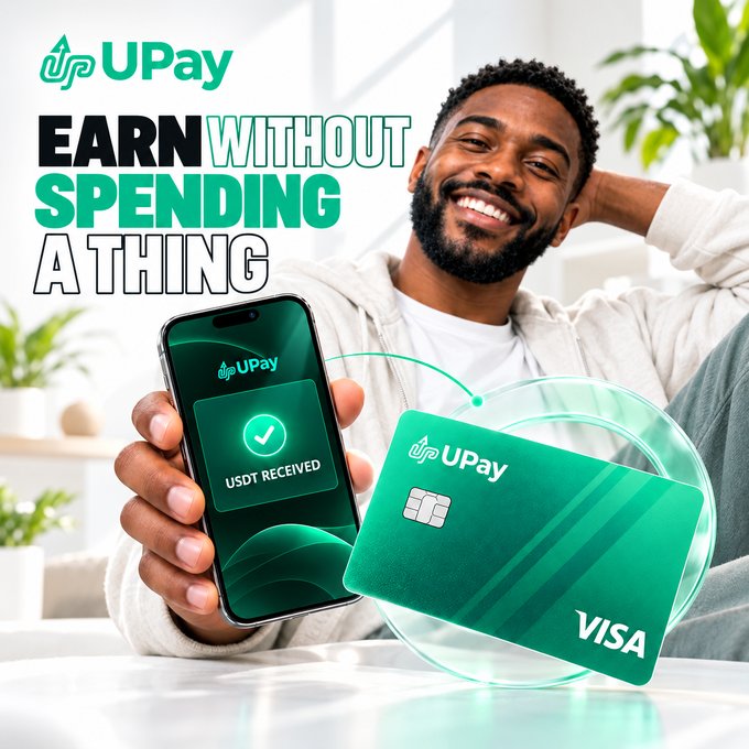 A promotional image for UPay showing a smiling man holding a phone displaying 'USDT RECEIVED' next to a green Visa card, with the tagline 'EARN WITHOUT SPENDING A THING.'