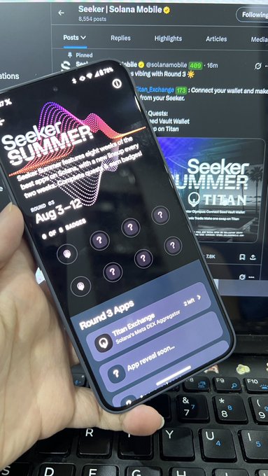 A hand holds a smartphone displaying the "Seeker SUMMER" airdrop interface with a Round 3 Apps list featuring Titan Exchange, while the background shows the corresponding Seeker/Solana Mobile social media post about Round 3 rewarding on Seeker.