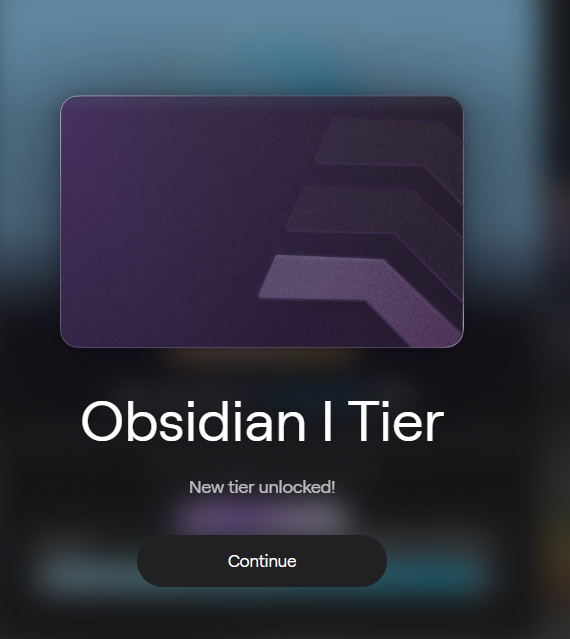 A digital tier unlock screen displaying a purple card with the text 'Obsidian I Tier' and 'New tier unlocked!' above a 'Continue' button.