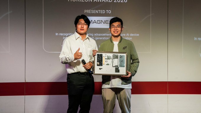 Two men pose on stage at the WebX Tokyo conference, with one holding a "HORIZON AWARD 2026" plaque presented to MAGNE.AI for secure AI device infrastructure and Web3 innovation, matching the post's announcement of receiving the unexpected recognition.