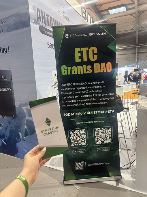 The image shows a person holding up two items - a green and white card with the words "Etc." written on it, and another card that says "Etc.". The person's hand is positioned over these cards, suggesting they are displaying them for others to see or use.
