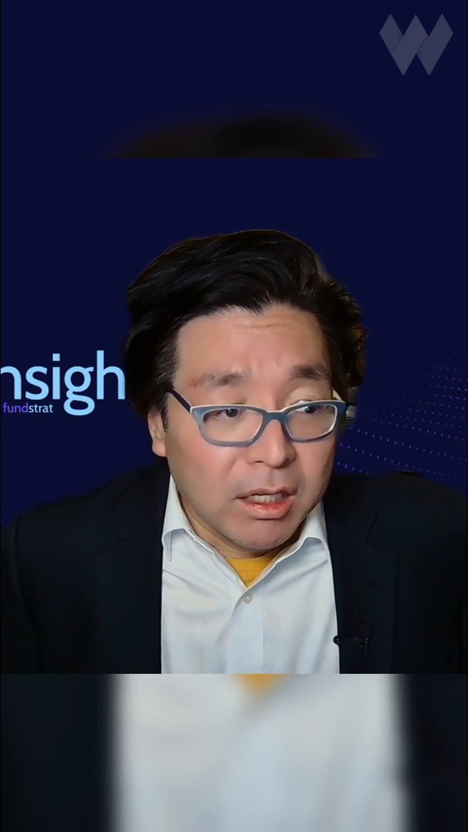 The image shows a man wearing glasses, dressed in a suit, and talking into a microphone. The background of the image is blue with white text that reads "insight fundamental".