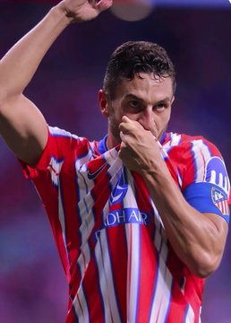A player wearing an Atlético Madrid jersey with "QATAR AIRWAYS" sponsorship and the club's crest gives an emotional kiss gesture toward the crowd. The image visually reinforces the post's news about a massive $680k bet on Atlético Madrid winning their match against Malaga.