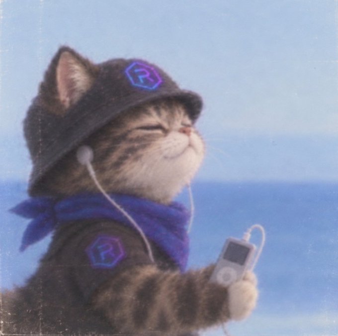 A tabby cat wearing a dark hood and a blue bandana, featuring the 'R' logo, listens to earphones connected to an iPod against a blue background.