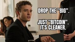 A meme image of a man in a suit at what appears to be a business meeting, with text reading: "DROP THE 'BIG'. JUST 'BITCOIN'. IT'S CLEANER."