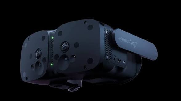 The image shows the **Somnium VR1** headset, a sleek black VR device with the "Somnium VR1" branding visible on the side strap, featuring multiple camera/sensor lenses on its front faceplate. The post defends the VR1's size by showing this stylish, modular-looking headset alongside a "cool mod" modification, countering criticism that it's too bulky by highlighting its customizability and design appeal.