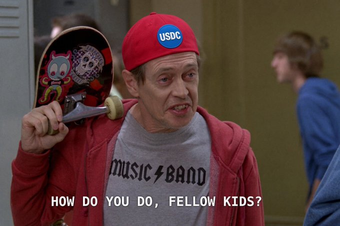 A man wearing a red cap with a "USDC" button and a "MUSIC BAND" shirt holds a skateboard over his shoulder, with text reading "HOW DO YOU DO, FELLOW KIDS?".