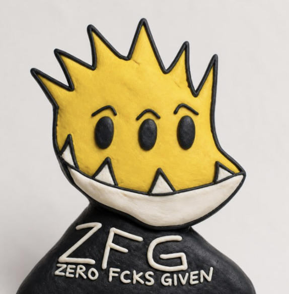 A 3D-rendered figurine of a yellow spiky-haired character with a mischievous grin, wearing a black shirt labeled 'ZFG ZERO FCKS GIVEN'.