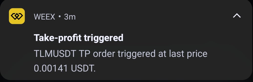 A WEEX notification alert indicating a take-profit order was triggered for the TLMUSDT trading pair at a price of 0.00141 USDT.