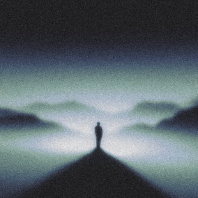 A silhouetted person stands at the tip of a dark triangular shape against a dreamy, blurred landscape with green and blue tones.