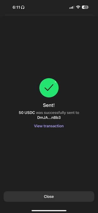 A mobile phone screenshot showing a successful cryptocurrency transaction confirmation: 'Sent! 50 USDC was successfully sent to DmJA...nBb3' with a green checkmark and a 'Close' button.