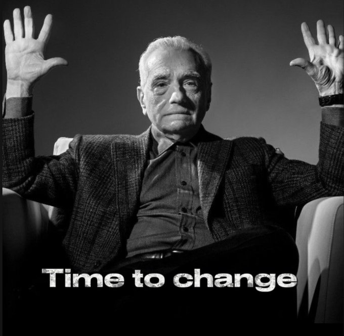 A black-and-white image of an older man with raised hands in a blazer, with the text 'Time to change' displayed at the bottom.