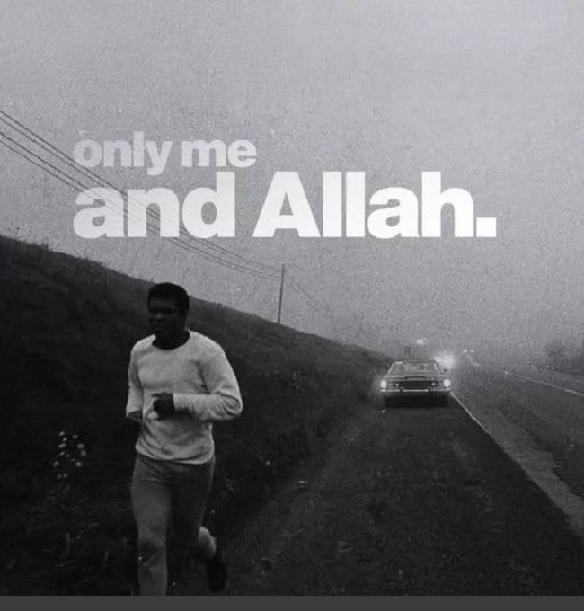 Black and white image of a man running on a foggy road with a car in the distance, overlaid with the text 'only me and Allah.'