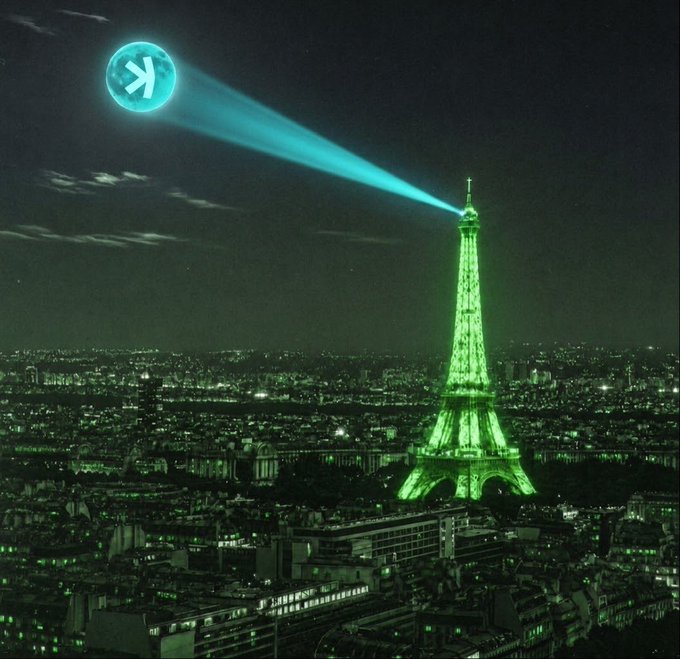A nighttime digital artwork of Paris with the Eiffel Tower lit green, casting a beam of light toward the Kaspa (KAS) cryptocurrency logo glowing as a celestial body in the sky.