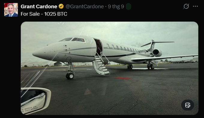 Tweet by Grant Cardone (@GrantCardone) reading 'For Sale - 1025 BTC' accompanied by a photo of a private jet on a tarmac.