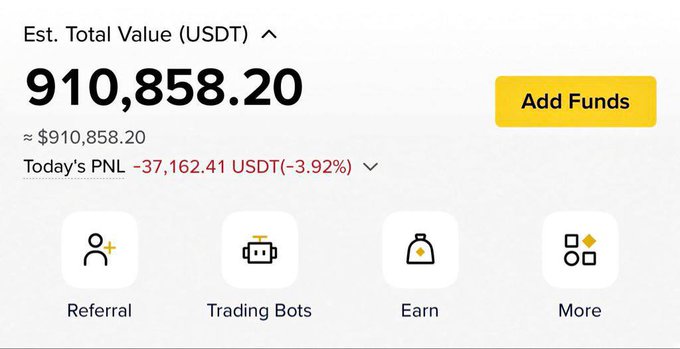 The image shows a Binance trading dashboard displaying an "Est. Total Value (USDT)" of 910,858.20 with a daily PNL loss of -37,162.41 USDT (-3.92%), along with menu options for Referral, Trading Bots, Earn, and More. This appears to be a screenshot being shared in a promotional post claiming to bless followers, likely as a flex of trading earnings or losses to attract engagement for @KivoTRX.