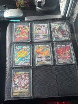 A 9-pocket binder page displays seven holographic Pokémon trading cards, including recognizable characters like Pikachu, Charizard, and others, alongside two empty slots—visually representing the digital collectibles market. The image complements the post about onchain gacha hitting an all-time high of $324.6M in June volume, with the physical trading cards symbolizing the enduring appeal of collectible markets even amid crypto market pullbacks.